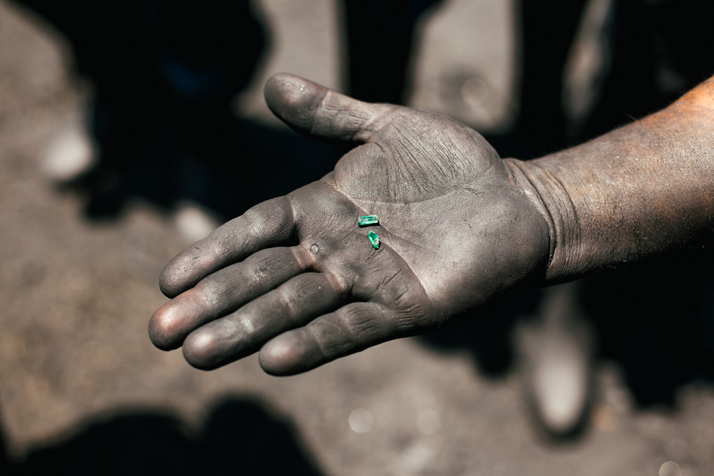 Photo A miner holds in his hand two emeralds he has found in the morning shift in Colombia