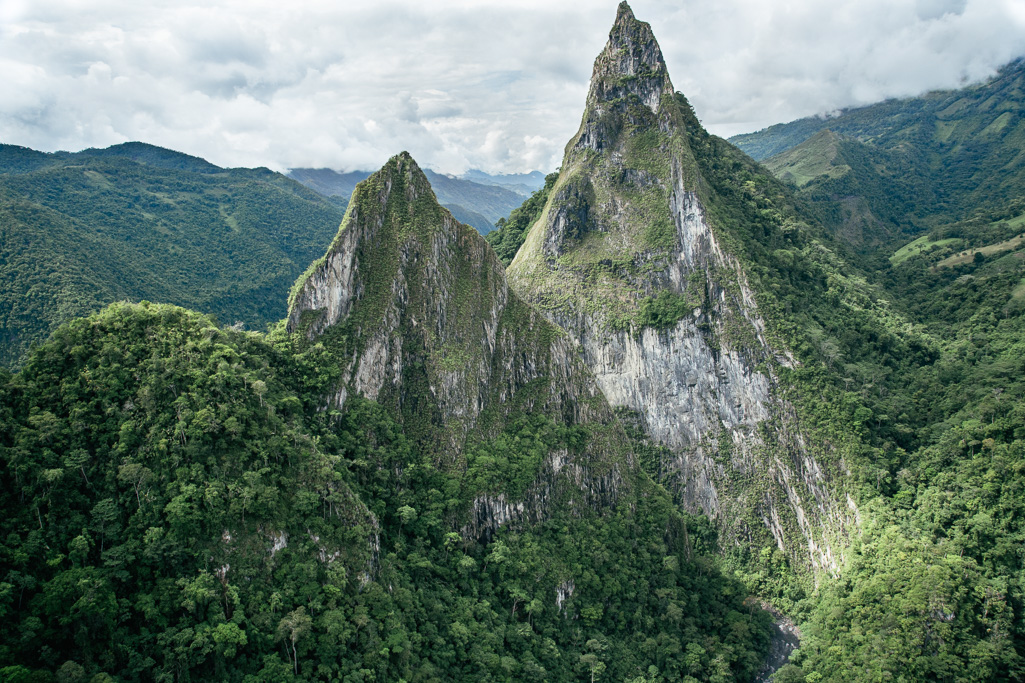 Photo Left, miner. Right, the iconic and mythical mountains Fura and Tena straddling the Rio Minero, and under which legendary deposits of emeralds are said to lie.