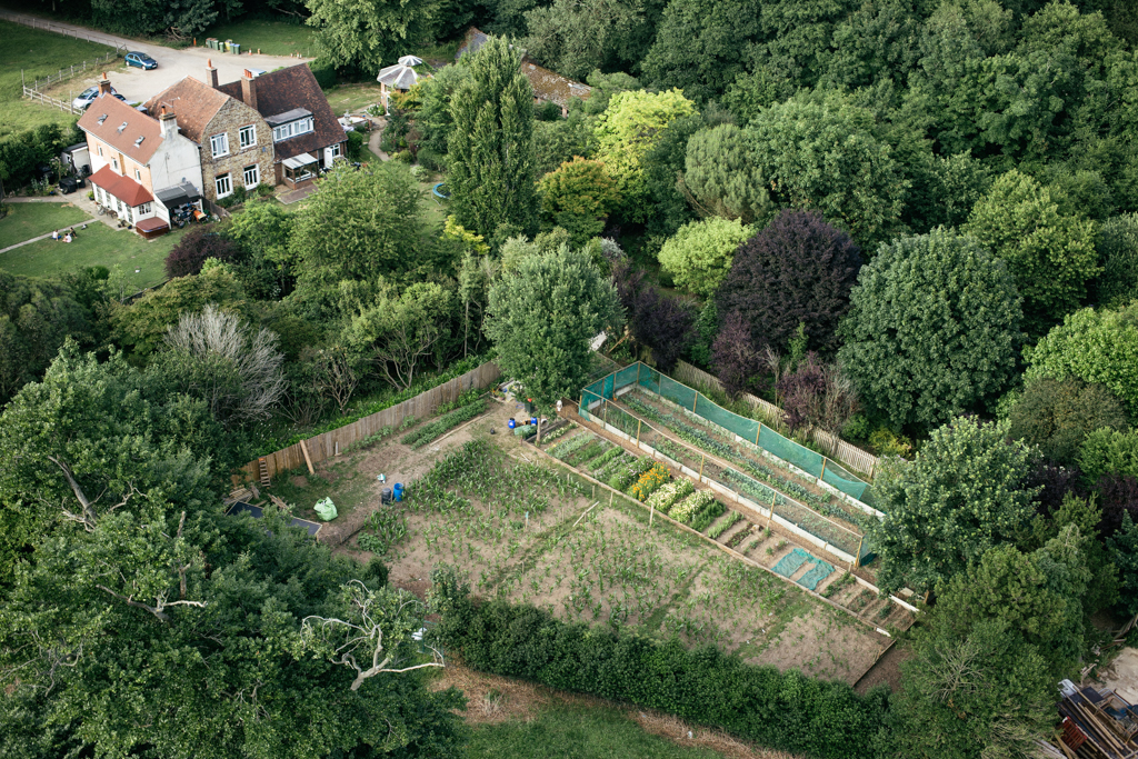 Photo Aerial views of the family farm. Farmhouse garden.