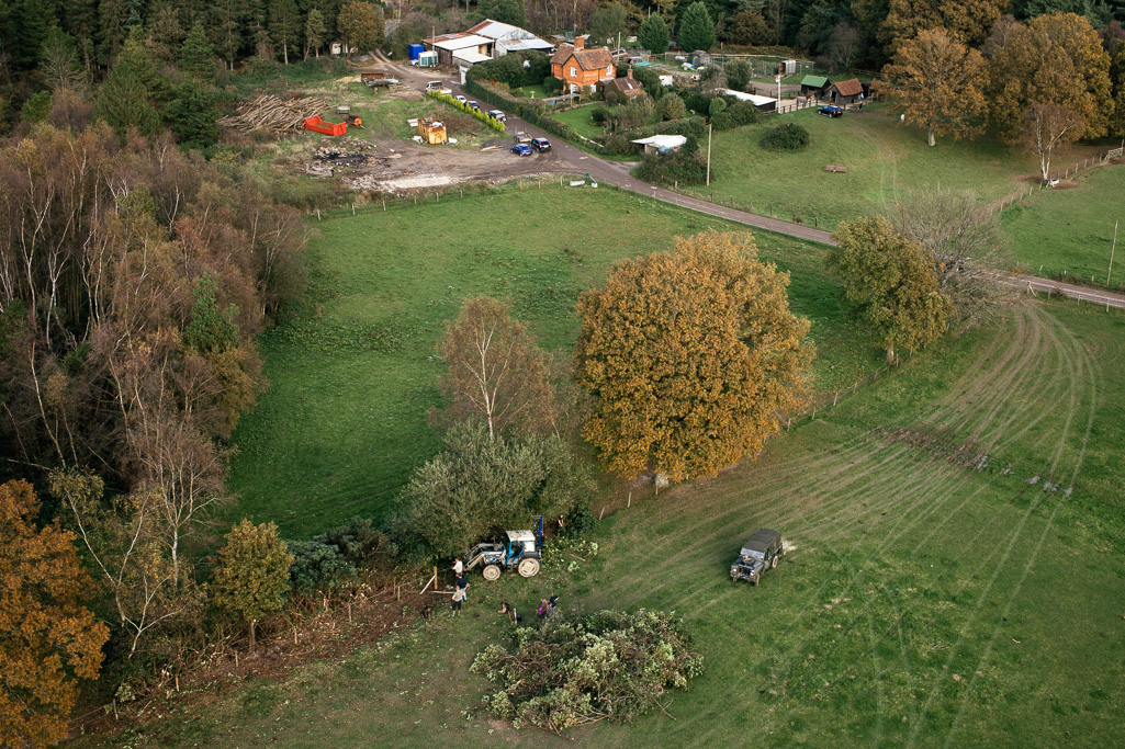 Photo Aerial views of the family farm. Fence repairs.