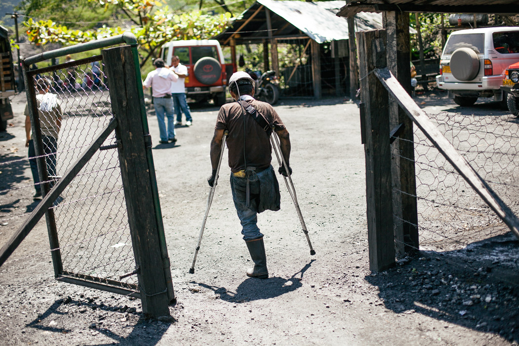 Photo Luis Arango, a trusted employee in charge of going in alone and picking out the stones if a vein of emeralds is found, leaves a mine entrance in Muzo. 