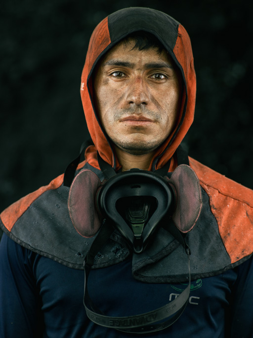 Photo Left, a welder in his red heat proof cape. Right, a water pump.